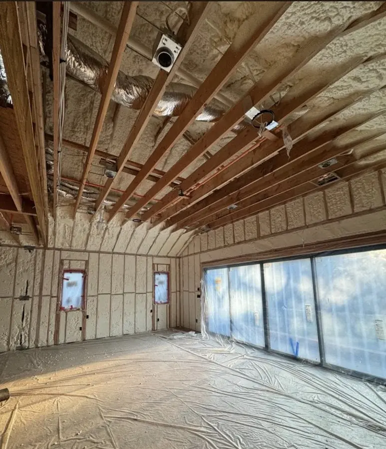 Interior walls and ceiling insulated with spray foam during new construction in Tyngsborough